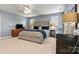 This main bedroom features carpet, a ceiling fan, and dresser at 10210 Roosevelt Dr, Huntersville, NC 28078