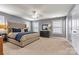 This main bedroom features carpet, a ceiling fan, and stylish gray walls at 10210 Roosevelt Dr, Huntersville, NC 28078