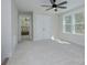 Bright bedroom with ceiling fan and carpet flooring at 1033 Harrogate Dr, Bessemer City, NC 28016