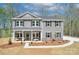 Charming two-story home with covered front porch and manicured landscaping at 1033 Harrogate Dr, Bessemer City, NC 28016