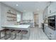 Modern kitchen features an island with seating, stainless appliances, and white and gray cabinets at 1033 Harrogate Dr, Bessemer City, NC 28016