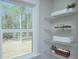 This shelving unit features multiple shelves, a view out the window and space for organizing at 1033 Harrogate Dr, Bessemer City, NC 28016