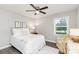 Comfortable bedroom with a ceiling fan, and a cozy seating area at 1041 Brawley School Rd, Mooresville, NC 28117
