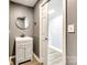 Gray half bathroom with modern vanity at 107 Maurice St, Monroe, NC 28112