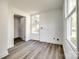 Bonus room features wood-look flooring, and natural light from multiple windows at 107 Maurice St, Monroe, NC 28112