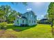 Exterior view of light blue two-story home with a manicured lawn at 107 Maurice St, Monroe, NC 28112
