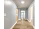 Hallway features wood-look flooring, fresh paint, and white trim details at 107 Maurice St, Monroe, NC 28112
