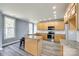 Modern kitchen with granite countertops, a center island, and stainless appliances at 107 Maurice St, Monroe, NC 28112