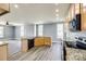Open-concept kitchen featuring stainless steel appliances, granite countertops, and barstool seating at 107 Maurice St, Monroe, NC 28112