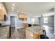 Modern kitchen with granite countertops, a center island, and stainless appliances at 107 Maurice St, Monroe, NC 28112