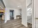 Open-concept floor plan with wood-look flooring and neutral paint tones at 107 Maurice St, Monroe, NC 28112