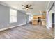 Open-concept living area with an eat-in kitchen featuring stainless steel appliances at 107 Maurice St, Monroe, NC 28112