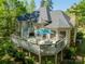 Aerial view of the house with a large deck and beautiful landscaping at 108 Tall Oak Dr, Mooresville, NC 28117