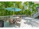 A spacious back deck features an outdoor dining area to enjoy outdoor living at 108 Tall Oak Dr, Mooresville, NC 28117