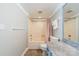 A well-lit bathroom with a shower and tub combo and grey-blue vanity at 108 Tall Oak Dr, Mooresville, NC 28117