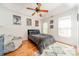 Bedroom features a cozy bed, gray beanbag chair, and hardwood floors at 108 Tall Oak Dr, Mooresville, NC 28117