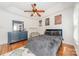 Bedroom features a cozy bed, blue dresser, hardwood floors, and movie poster art at 108 Tall Oak Dr, Mooresville, NC 28117