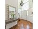 Bright foyer with high ceilings, hardwood floors, and a decorative mirror and table at 108 Tall Oak Dr, Mooresville, NC 28117