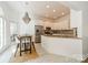 Bright eat-in kitchen features a stone countertop, stainless steel appliances and a chandelier at 108 Tall Oak Dr, Mooresville, NC 28117