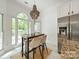 Eat-in kitchen with a chandelier, stainless steel refrigerator and large windows at 108 Tall Oak Dr, Mooresville, NC 28117