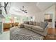 Spacious living room with a large sectional sofa, fireplace, and views of the backyard at 108 Tall Oak Dr, Mooresville, NC 28117