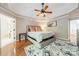 Spacious main bedroom with trey ceilings, wood floors, a ceiling fan, and a neutral color palette at 108 Tall Oak Dr, Mooresville, NC 28117