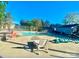 Community pool features ample seating, a large pool, a secure fence, and a clear blue sky at 11163 Harrowfield Rd # 8198, Charlotte, NC 28226