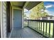 View of the deck and the blue railing that provides a view of the surrounding area at 11163 Harrowfield Rd # 8198, Charlotte, NC 28226