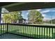 View from the deck features a lush green space, sidewalks, and other condos at 11163 Harrowfield Rd # 8198, Charlotte, NC 28226
