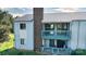 A lovely view of a condo with a chimney and dual level outdoor balconies at 11163 Harrowfield Rd # 8198, Charlotte, NC 28226