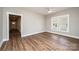 Bright, spacious bedroom featuring hardwood floors and a large window for ample natural light at 1143 N College Ave, Newton, NC 28658