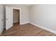 Bedroom with wood-look floors and a door leading to another room at 1143 N College Ave, Newton, NC 28658