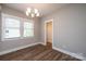 A bright bedroom features a modern chandelier and neutral color palette at 1143 N College Ave, Newton, NC 28658