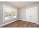 Bedroom with a closet with double doors, and a window with blinds at 1143 N College Ave, Newton, NC 28658