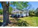 Beautifully landscaped front yard highlighting the charming exterior of this well-maintained home at 1143 N College Ave, Newton, NC 28658