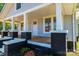 Close-up of a cozy front porch with brick detailing and charming architectural elements at 1143 N College Ave, Newton, NC 28658