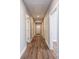 A neutrally decorated hallway featuring durable wood-look floors and modern fixtures at 1143 N College Ave, Newton, NC 28658
