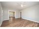Open-concept living room with hardwood floors and large openings for seamless flow at 1143 N College Ave, Newton, NC 28658