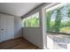 Enclosed sun room with windows and backyard view for relaxing and enjoying natural light at 1143 N College Ave, Newton, NC 28658