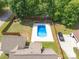 Aerial view of backyard with in-ground pool, mature trees and fenced yard at 1228 Quiet Acres Rd, Rock Hill, SC 29732