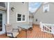 Outdoor deck area perfect for entertaining with seating and a table at 1228 Quiet Acres Rd, Rock Hill, SC 29732