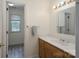 Bathroom featuring a wood vanity with solid surface top and framed mirror at 1228 Quiet Acres Rd, Rock Hill, SC 29732