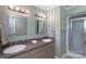 Bathroom featuring double vanity sinks and a walk-in shower at 1228 Quiet Acres Rd, Rock Hill, SC 29732