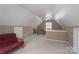 Lofted bonus room features a futon and built-in shelving at 1228 Quiet Acres Rd, Rock Hill, SC 29732