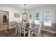 Bright dining room with hardwood floors, windows, and a view of the pool at 1228 Quiet Acres Rd, Rock Hill, SC 29732