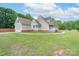 Spacious home exterior with a detached garage and ample yard space at 1228 Quiet Acres Rd, Rock Hill, SC 29732