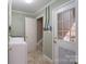 Functional laundry room with tile flooring, and exterior door at 1228 Quiet Acres Rd, Rock Hill, SC 29732