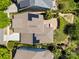 Aerial view showcases a well-maintained house, lush backyard, and solar panels on the roof at 12614 Robert Walker Dr, Davidson, NC 28036