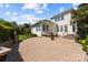 Charming backyard with built-in grill, patio and lush landscaping perfect for outdoor relaxation at 12614 Robert Walker Dr, Davidson, NC 28036