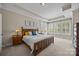 Serene bedroom with plenty of natural light, tray ceiling, and neutral decor at 12614 Robert Walker Dr, Davidson, NC 28036